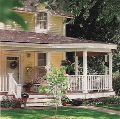 a house with a porch and white railings