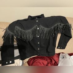 Black Denim Jacket With Rhinestone Fringe. Brand New, Never Worn. Size Medium Fitted Long Sleeve Outerwear With Rhinestone Fringe, Trendy Denim Jacket With Rhinestone Fringe For Fall, Casual Denim Jacket With Rhinestone Fringe, Casual Long Sleeve Denim Jacket With Rhinestone Fringe, Fall Denim Outerwear With Rhinestone Fringe, Denim Outerwear With Rhinestone Fringe For Fall, Casual Denim Jacket With Rhinestone Fringe For Fall, Winter Denim Jacket With Rhinestone Fringe And Long Sleeves, Winter Long Sleeve Denim Jacket With Rhinestone Fringe