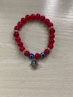 Red fragile glass bead bracelet with blue evil eyes and silver spacer beads, handmade Glass Bead Bracelet, Evil Eyes, Red Bracelets, Blue Evil Eye, Eye Bracelet, Beads Handmade, Glass Beaded Bracelets, Tampa Fl, Evil Eye Bracelet