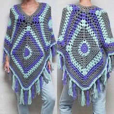 the woman is wearing a crocheted ponchy with fringes on it