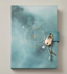 a small notebook with a key on it