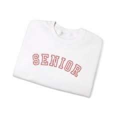 Please note the sweatshirt and lettering colors as follows:   Sweatshirt color  -  Lettering color 1. Red - White lettering 2. Grey - Black lettering 3. Navy - Lt Blue lettering 4. White - Pink lettering Senior sweatshirt gift for the graduate. Ideal for any situation, a unisex heavy blend crewneck sweatshirt is pure comfort. These garments are made from polyester and cotton. This combination helps designs come out looking fresh and beautiful. The collar is ribbed knit, so it retains its shape e Varsity Sweatshirt With Letter Embroidery For College, Varsity T-shirt With Letter Embroidery For College, Varsity T-shirt With Letter Embroidery, College Sweatshirt With Letter Embroidery For School Spirit, Collegiate Letter Embroidery Sweatshirt For College, College Sweatshirt With Letter Embroidery, Sporty T-shirt With Embroidered Text For College, School Spirit Sweatshirt With Lettering For Streetwear, Varsity Sweatshirt With Letter Embroidery For Campus