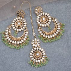 This 'URWA' Hight Quality Pakistani Kundan Earrings and Maang Tikka Set are the ultimate in versatile  Indian jewelry. Wear them together or Tikka and Earrings Their own. you can create three different looks with one set. Choose from two colors: Mint and Red Earrings drop Lenth: 10cm width: 5.5cm Tikka Drop 9cm approx This gorgeous pair is made on brass as base metal and handcrafted to perfection with studded white beads, Kundan stones, and blush onyx beads. you don't have to opt for the minimalistic all the time. Sometimes it's better to go OTT. Luxury White Hand Set Tikka, Green Tikka Jewelry, Maang Tikka Set, Pakistani Jewellery, Mint Green Earrings, Chandbali Earrings, Maang Tikka, Pakistani Jewelry, Versatile Jewelry