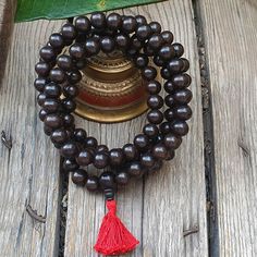 📿Karungali (black ebony wood) is a very powerful tree which our ancestors used. It was used in ancient temples and temple towers (kalasam); was also used in significant homams and other pooja rituals. Ebony Wood Mala is here to remind us to be current and clear-headed so we can make wise and informed decisions. We are being asked to seek new ways to create beauty and harmony that are sustainable for the long-term. This is a time to bring clarity to our intentions as we focus on the future.📿 ✨ Future Board, Buddhist Mala, Ancient Temples, Wood Necklace, Ebony Wood, Prayer Beads, Handmade Necklace, Handmade Necklaces, Necklace Etsy