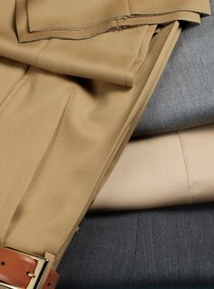 Elegant Beige Tailored Pants, Elegant Beige Pants, Luxury Dress Pants With Concealed Placket, Luxury Pants With Pressed Crease, Elegant Beige Dress Pants With Pressed Crease, Elegant Beige Dress Pants With Pockets, Elegant Beige Pants With Welt Pockets, Luxury Beige Workwear Pants, Elegant Beige Bottoms