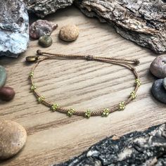 This is a simple way to add a little green to your wrist any time of the year, and it may or may not give the wearer extra luck  The "Clover" bracelet also can help prevent a pinch on St. Patrick's Day too! This bracelet matches perfectly with the "Shamrock (peridot green)" charm bracelet: https://colorsoftheprairie.etsy.com/listing/1673648742  Please keep in mind that even though I try my best to keep the spacing even between clovers, I'm not a machine and the spaces are not all perfectly equal Green Adjustable Jewelry For Festivals, Green Adjustable Jewelry For Festival, Green Adjustable-length Jewelry For Festival, Nature-inspired Adjustable Beaded Bracelet With Round Beads, Hippie Green Friendship Bracelets As Gift, Hippie Green Bracelet Jewelry, Earthy Adjustable Jewelry With Sliding Knot, Adjustable Beaded Nature-inspired Bracelet, Earthy Adjustable Friendship Bracelets With Sliding Knot