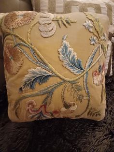 a close up of a pillow on a couch