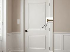 a white door with a black handle on it