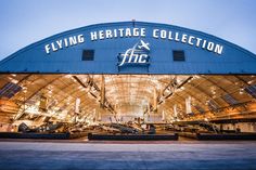 the flying heritage collection building is lit up at night