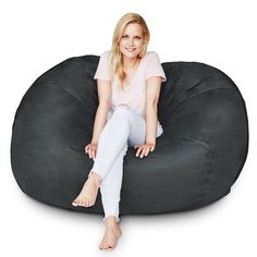 a woman sitting on a bean bag chair