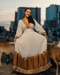 Golden Brown Shimena Beauty: A Gorgeous Habesha Dress with Menen Fabric and Tilf Chain Design, Habesha Kemis, Eritrean dress, ሀበሻ Brown Wedding Dress For Eid, Gold Gown For Traditional Ceremonies At Eid, Gold Embroidered Dresses For Traditional Ceremonies And Festivals, Ceremonial Dresses With Gold Embroidery For Festivals, Traditional Beige Floor-length Dress, Brown Festive Dress For Eid, Traditional Gold Gown With Dabka Details, Gold Kaftan For Ceremonial Festivals, Traditional Beige Dresses For Eid