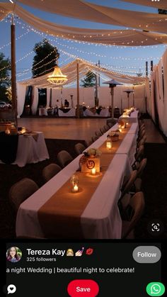 an image of a table set up for a wedding with candles on the tables and lights hanging from the ceiling