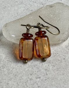 "small yellow brown earrings   rectangle czech glass earrings   brass boho dangle earrings * Czech glass rectangle beads - 8x12mm * transparent milky light yellow with heavy brown Picasso coating on edges * brown glass disc on top * antiqued brass hook ear wires * total length - 1 1/4\" * you can enter my shop here:    gypsydangles.etsy.com" Cheap Brown Earrings For Party, Cheap Traditional Brown Earrings, Classic Brown Rectangular Jewelry, Bohemian Brown Rectangular Jewelry, Handmade Rectangular Earrings For Everyday, Handmade Rectangular Everyday Earrings, Amber Czech Glass Earrings With Ear Wire, Handmade Everyday Rectangular Earrings, Handmade Rectangular Minimalist Earrings