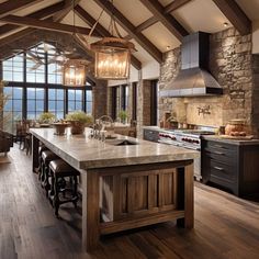 a large kitchen with an island in the middle and lots of counter space on one side