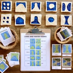 the land and water forms are displayed on a clipboard next to some cut outs