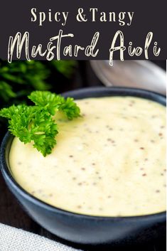 spicy and tangy mustard sauce in a black bowl with parsley garnish