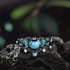 Gothic Black Gold Round Cut Turquoise Engagement Ring Bridal Sets Nature Inspired Cluster Promise Ring Art Deco Leaf Blue Gemstone Branch --->Ring details: - Metal :The underneath metal is in Silver/ 10K/14K/18K white gold, coated with black rhodium - Theme:Romantic Wedding & Engagement - comfortable band - Center Stone :Turquoise - Carat: 6.0mm - Side stone : Turquoise +  moissanite - Side stone:0.48ctw - wedding band :Lab opal + Turquoise+moissanite - 0.12ctw  Materials: - 14k rose gold/14k wh Turquoise Gemstone Jewelry For Promise Ring, Turquoise Jewelry With Gemstone Accents For Promise Ring, Bohemian Aquamarine Jewelry, Bohemian Aquamarine Turquoise Jewelry, Bohemian Turquoise Aquamarine Jewelry, Bohemian Aquamarine Jewelry In Turquoise, Turquoise Aquamarine Gemstone Rings, Blue Aquamarine Multi-stone Jewelry, Blue Multi-stone Aquamarine Jewelry