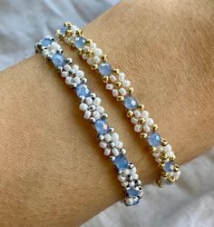 More details: - made out of white and golden or silver miyuki seed beads and blue crystal beads - threaded on nylon - closed with lobster clasps, jump rings 4mm, crimp ends and crimp covers made out of gold plated stainless steel  - available in six sizes: 15cm, 16cm, 17cm,  18cm, 20cm and 22cm How to take care: - the material is quite durable but as the stainless steel is gold plated, it is advisable to take off the bracelet when showering, for the colour to last longer Follow my Instagram @flo White Bracelets With Silver Beads For Jewelry Making, White Friendship Bracelets With Faceted Round Beads, White Dainty Bracelet With Faceted Beads, White Tiny Beads Friendship Bracelets For Jewelry Making, Adjustable White Crystal Beaded Bracelets, White Round Beads Friendship Bracelets For Jewelry Making, White Crystal Beaded Bracelets, Dainty White Bracelets With Faceted Beads, White Jewelry With Gold Beads For Friendship