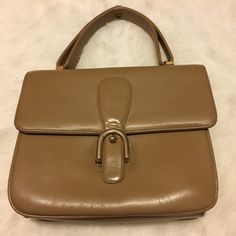 "Vintage Camel colored purse with 1 zippered pocket and 2 open pockets inside. No brand or material labels or markings. Appears to be leather. Has cracking from use, age, and storage but still beautiful. Approximate measurements: 7\" x 8\" x 2.5\" with 4\" handle" Vintage Beige Shoulder Bag With Zipper Closure, Vintage Beige Bag With Zipper Closure, Vintage Top Handle Bag With Zipper Closure, Vintage Top Handle Satchel With Zipper Closure, Vintage Handheld Satchel With Zipper Closure, Vintage Satchel With Zipper Closure For Daily Use, Daily Use Vintage Satchel With Zipper Closure, Vintage Tote Satchel With Zipper Closure, Vintage Tote Satchel With Zipper