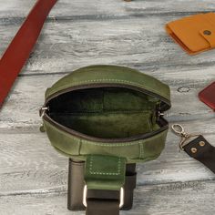 This leather Fanny Pack is perfect for carrying around the essentials at festivals, concerts, hikes, or just being on the go! With it's one of a kind design that has been hand-crafted from start to finish, the quality of our workmanship is reflected in our product. A great gift for that someone special in your life or as a gift to yourself! Adjustable shoulder strap. Size: - Length -- 11.5 inches |29 cm| - Height -- 7 inches |18 cm| - Width -- 2.5 inches |6 cm| -- Material: 100% genuine, high qu Green Bags With Coin Pocket For Daily Use, Green Bags With Coin Pocket, Green Rectangular Bag With Coin Pocket, Green Daily Use Bag With Coin Pocket, Everyday Chest Bag With Cell Phone Pocket, Leather Sling Bag Men, Waist Bag Leather, Sling Bag Men, Waist Bag Women