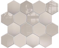 a white hexagonal tile pattern with several mirrors