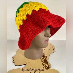 Red Yellow & Green Rasta Colors Granny Stripe Stitch Handmade Acrylic Crochet Bucket Hat Os Condition: New; Ready To Ship Color: Red, Yellow & Green Unstretched Flat Approximate Measurements: Total Length- 9”; 3” Length ( Body); 3” Length (Brim) Head Size For Ideal Fit: One Size Fits Most 20-22” Heads *Model Head Is 19.5” Materials: 100% Acrylic Hand Wash; Lay Flat To Dry This Handmade Acrylic Crochet Bucket Hat Features The Iconic Colors Of The Rasta Flag - Red, Yellow, And Green, Arranged In A Granny Stripe Stitch, Crochet Loom, Rasta Flag, Jamaica Colors, Crochet Construction, Granny Stripe, Rasta Colors, Running Hats