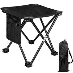 a black folding table with a bag next to it