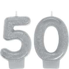 two birthday candles with the number 30 on each one, in white frosted plastic