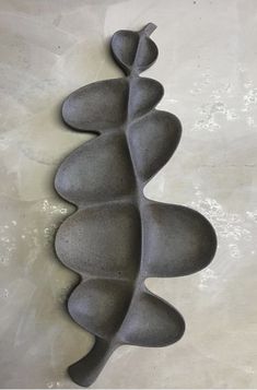 an abstract sculpture is shown on the wall