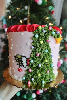 a decorated christmas tree cake on a platter