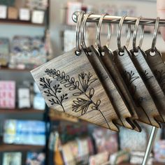 a person is holding some kind of wooden item in front of a store shelf with other items on it