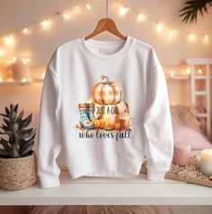 Ideal for any situation, these Just a Girl Who Loves Fall with a plaid pumpkin and boots and a pumpkin spice latte on a heavy blend, crewneck, women's (unisex) sweatshirt are pure comfort. These garments are made from polyester and cotton which helps the designs come out looking fresh and beautiful. The collar is ribbed knit, so it retains its shape even after washing. There are no itchy side seams on these sweatshirts.  A soft and comfy Autumn pullover sweatshirt gift for any mother or your significant other that is sure to please!    **PLEASE SCROLL FURTHER FOR SIZING** COLOR OPTIONS: White, Ash, Sand **Please see pdf Color Chart provided in the images section that displays all color options available for this shirt, but not necessarily for this specific design.  (I can make any of these Cute Plaid Tops For Fall, Plaid Cotton Sweatshirt For Fall, Plaid Pumpkin, Autumn Sweater, White Ash, Fall Clothing, Sweatshirt Cute, Cozy Autumn, Sweater Gift