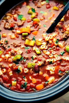 a close up of a bowl of chili macaroni soup