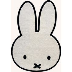 a white rug with a black outline of a rabbit's head on top of it