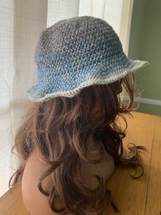 A multicolored floppy bucket hat featuring lots of blue hues variegating to a light blue and white brim 💙 1 size fits most for adults! Made with 00% acrylic yarn 🧶 Casual Blue Wide Brim Bucket Hat, Blue Yarn Bucket Hat For Spring, Light Blue Casual Bucket Hat For Beach, Casual Blue Bucket Hat One Size, Casual Light Blue Bucket Hat For The Beach, Casual Light Blue Bucket Hat For Beach, Adjustable Blue Bucket Sun Hat, Blue Casual Bucket Hat With Curved Brim, Blue Crochet Bucket Hat For Spring