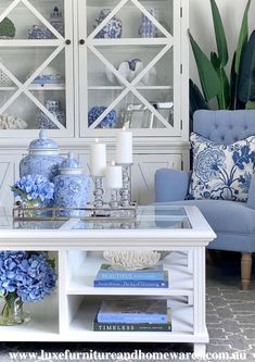 a living room with blue and white decor