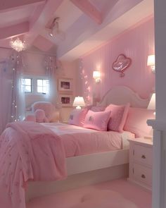 a bedroom decorated in pink and white with lots of lights on the ceiling above the bed