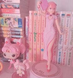 there is a doll next to some books