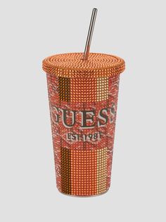 an orange cup with a straw sticking out of it's top and the words guess on it