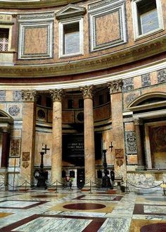 the inside of a building with many pillars