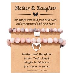 mother and daughter bracelets with heart charms on the front, two pink beads are attached to