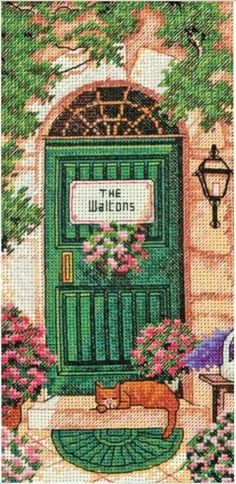 a cross stitch picture of a green door with flowers and a cat on the doorstep