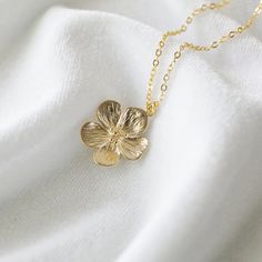 "Beautiful and lovely gold flower necklace.  Made of semi-matte finish gold flower with skinny gold brass chain.  A simple and natural-looking dainty necklace is good for yourself or gift! Your necklace will ship in a lovelike gift box. If you have any questions please feel free to contact me. Thanks :)  ♥ Chain length available 14\" - 20\"  ♥ Flower pendant 3/4\"   ♥ Gold Plated over Brass   ♥ ♥ ♥ ♥ ♥ ♥ ♥ ♥ ♥ ♥ ♥ ♥ ♥ ♥ See more by lovelikestyle lovelikestyle.etsy.com ♥ ♥ ♥ ♥ ♥ ♥ ♥ ♥ ♥ ♥ ♥ ♥ ♥ ♥ 14k Gold Filled Flower Necklace, 14k Gold-filled Flower Necklace, Feminine Gold Necklaces For Bridesmaid Gift, Minimalist Gold Birth Flower Necklace, Gold Flower Necklace For Her Birthday, Gold Birth Flower Necklace Gift For Her, Delicate Gold Charm Necklaces In Brass, Gold Flower Pendant Necklace With Adjustable Chain, Dainty Brass Necklace With Flower Pendant