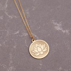 "14K Real Lotus Flower Necklace, ( Dainty Solid Lotus Balance Pendant, Lotus Amulet Disc Jewelry ) is lightweight and shine in the light. This necklace is a perfect gift for a mom, a sister, or your wife on Christmas, birthday, anniversary. Materials: 14K Solid Gold Style: Minimalist Pendant Size : Height 16mm x Weight 16mm Chain Style: Cable Chain Length: from 12\" to 22\" Finish: White Gold, Gold OTHER INFORMATION MATERIAL - We produce our jewelry with High-Quality 14K Solid Gold from precious Spiritual Medallion Necklace For Wedding, Rose Gold Medallion Jewelry With Birth Flower, Spiritual Wedding Coin Pendant Necklace, Spiritual Wedding Necklace With Coin Pendant, Spiritual Wedding Jewelry With Coin Pendant, Medallion Necklace With Flower Charm For Anniversary, Traditional Jewelry With Flower Charm As Gift, Flower Charm Medallion Jewelry For Anniversary, Traditional Jewelry With Flower Charm For Gifts