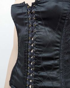 For Sale on 1stDibs - D&G top lace up bustier with black laces details. Circa 1990s. Rare. · Alternating black satin and lace · Criss cross zig zag top stiching · Adjustable Black Satin Corset Dress With Boning, Black Satin Underbust Corset Dress, Black Party Corset With Lace-up Back, Black Satin Overbust Corset, Gothic Black Corset Dress With Lace-up Back, Black Lace-up Back Corset For Night Out, Black Corset With Lace Trim And Fitted Bodice, Black Satin Corset With Corset Back, Fitted Underbust Corset With Lace Closure