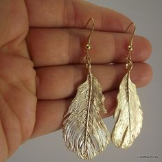 Bold Gold Feather Earrings by JSWMetalWorks Elegant Feather Earrings For Gift, Gold Feather Jewelry For Wedding, Gold Feather Earrings For Party, Gold Feather Earrings As A Gift, Gold Feathered Jewelry For Parties, Gold Feather Earrings For Gift, Classy Dressing, Gold Wing-shaped Party Earrings, Elegant Feather Drop Earrings