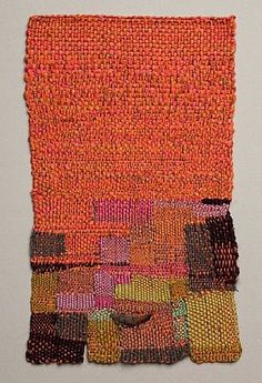 an orange piece of cloth with different colored squares on it