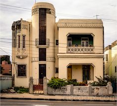 an old building with balconies on the second floor