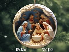 a nativity ornament hanging from a christmas tree with the birth of jesus