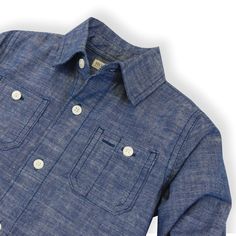 Our classic long sleeve button down chambray shirt is cut from super soft organic cotton and is the "goes-with-everything" wardrobe staple he won't want to take off. Features matte buttons at the chest pockets, cuffs, and center front. Pairs perfectly with our beautiful collection of organic cotton, sweaters, pants, and shorts! 100% Organic Cotton, exclusive of trims. Garment is 100% GOTS-Certified Organic. Learn more about our certifications here. Functional chest pockets with button closure. M Cotton Sweaters, Baby Boy Tops, Boy Outerwear, Baby Outerwear, Boys Bottoms, Chambray Shirt, Boys Long Sleeve